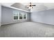 Spacious main bedroom with carpet and a ceiling fan at 8331 Burgundy Ridge Dr, Harrisburg, NC 28075