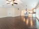 Open living area with hardwood floors and kitchen view at 8820 Rittenhouse Cir, Charlotte, NC 28270