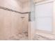 Large walk-in shower with tiled walls and a glass door at 8820 Rittenhouse Cir, Charlotte, NC 28270