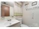 Small bathroom with toilet, sink, and grab bar at 9 Post Oak Pl, Salisbury, NC 28147