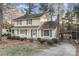 Two-story house with yellow siding, front porch, and landscaping at 9 Post Oak Pl, Salisbury, NC 28147