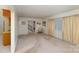 Spacious living room with carpet, large window, and view of staircase at 9 Post Oak Pl, Salisbury, NC 28147