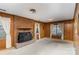 Living room with brick fireplace and wood paneled walls at 9 Post Oak Pl, Salisbury, NC 28147