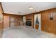 Cozy living room featuring a brick fireplace and built-in shelving at 9 Post Oak Pl, Salisbury, NC 28147