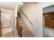 Simple wooden staircase leading to the upper level at 9 Post Oak Pl, Salisbury, NC 28147