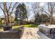 Spacious backyard with patio, string lights, and lush green grass at 9103 Cameron Wood Dr, Charlotte, NC 28210