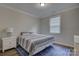 Cozy bedroom with striped bedding and blue rug at 9515 Liberty Hill Dr, Mint Hill, NC 28227