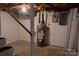 Basement utility area with water heater and painted walls and floors at 1035 Timberlane Dr, Lincolnton, NC 28092