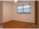 Minimalist bedroom featuring hardwood floors, a window, and neutral paint at 1035 Timberlane Dr, Lincolnton, NC 28092