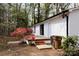 View of the back of the home showing the deck with brick trim and flowers; an entertaining space at 1035 Timberlane Dr, Lincolnton, NC 28092