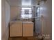 Practical laundry room featuring a washer and dryer, natural light, and functional layout at 1035 Timberlane Dr, Lincolnton, NC 28092