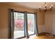 Relaxing living room featuring hardwood floors, a sliding glass door, and garden views at 1035 Timberlane Dr, Lincolnton, NC 28092