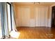 Spacious living room features gleaming hardwood floors and large closet space at 1035 Timberlane Dr, Lincolnton, NC 28092