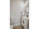 Small bathroom with white vanity and decorative mirror at 105 Fleishhacker Pl, Mooresville, NC 28117