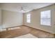 Well-lit bedroom featuring two windows, a ceiling fan and hardwood floors at 105 Fleishhacker Pl, Mooresville, NC 28117