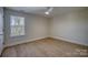 Bright bedroom with hardwood floors and window at 105 Fleishhacker Pl, Mooresville, NC 28117