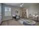 Bedroom with hardwood floors, window, and workspace at 105 Fleishhacker Pl, Mooresville, NC 28117