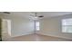 Spacious bedroom with two windows, ceiling fan and hardwood floors at 105 Fleishhacker Pl, Mooresville, NC 28117