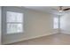 Simple bedroom with hardwood floors and two windows at 105 Fleishhacker Pl, Mooresville, NC 28117