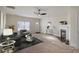 Living room with fireplace, hardwood floors, and furniture at 105 Fleishhacker Pl, Mooresville, NC 28117