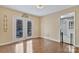 Cozy sun room with hardwood floors and french doors leading to outdoor patio at 138 Shadowgate Dr, Shelby, NC 28152