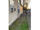 Tan mobile home exterior with a side yard and chain link fence at 145 Arrowood Trl # 61F, Mount Gilead, NC 27306