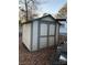 White and gray storage shed in the backyard at 145 Arrowood Trl # 61F, Mount Gilead, NC 27306
