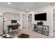 Bright bedroom featuring neutral decor, a workspace, and an adjacent laundry room at 1604 Village Grove Ln, Monroe, NC 28110