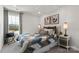 Cozy bedroom with neutral decor, a queen-size bed, and ample natural light at 1604 Village Grove Ln, Monroe, NC 28110