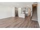 Open-concept kitchen with gray cabinets, stainless steel appliances, and an island at 1604 Village Grove Ln, Monroe, NC 28110