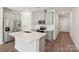 Kitchen with white countertops, gray cabinets, stainless steel appliances and modern fixtures at 1604 Village Grove Ln, Monroe, NC 28110