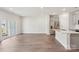 Open-concept living room with wood-style flooring and sliding glass doors to the outside at 1604 Village Grove Ln, Monroe, NC 28110