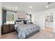 Main bedroom with ensuite bathroom and a geometric patterned duvet cover at 1604 Village Grove Ln, Monroe, NC 28110