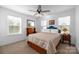 Cozy bedroom featuring a double bed and large windows at 235 Goldenrod Cir, Salisbury, NC 28147