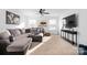 Bonus room with sectional sofa and large TV at 235 Goldenrod Cir, Salisbury, NC 28147