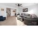 Bright bonus room with comfy sectional sofa and large artwork at 235 Goldenrod Cir, Salisbury, NC 28147