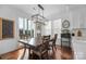 Bright dining area with table and chairs, and access to deck at 235 Goldenrod Cir, Salisbury, NC 28147