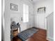Bright entryway with hardwood floors, white walls, and a small table at 235 Goldenrod Cir, Salisbury, NC 28147