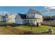 Gray house with white trim, landscaping, and a large yard at 235 Goldenrod Cir, Salisbury, NC 28147