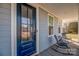 Blue front door with glass panes and a sidelight at 235 Goldenrod Cir, Salisbury, NC 28147