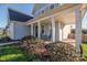 Covered front porch with rocking chairs and a blue door at 235 Goldenrod Cir, Salisbury, NC 28147
