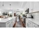 Modern white kitchen with stainless steel appliances and large island at 235 Goldenrod Cir, Salisbury, NC 28147