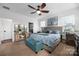 Main bedroom with dresser, seating area, and ceiling fan at 235 Goldenrod Cir, Salisbury, NC 28147