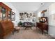 Sitting room boasts antique furniture and gallery wall of framed art at 235 Goldenrod Cir, Salisbury, NC 28147