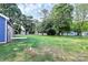 Expansive backyard featuring a well-kept lawn and mature trees, perfect for outdoor activities and relaxation at 2365 28Th Ne St, Hickory, NC 28601