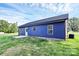 Backyard features a patio and blue siding, creating a welcoming outdoor space at 2365 28Th Ne St, Hickory, NC 28601
