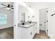 Modern bathroom featuring a double vanity with granite counters and stylish black fixtures at 2365 28Th Ne St, Hickory, NC 28601