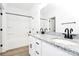 Modern bathroom showcasing double vanity, granite counters, and a clean, white tub/shower combo at 2365 28Th Ne St, Hickory, NC 28601