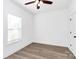 Bedroom features a ceiling fan, a window for natural light, and modern flooring, creating a comfortable space at 2365 28Th Ne St, Hickory, NC 28601