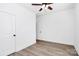 Bright bedroom with a ceiling fan, modern flooring, and a closet door enhancing the room's appeal at 2365 28Th Ne St, Hickory, NC 28601